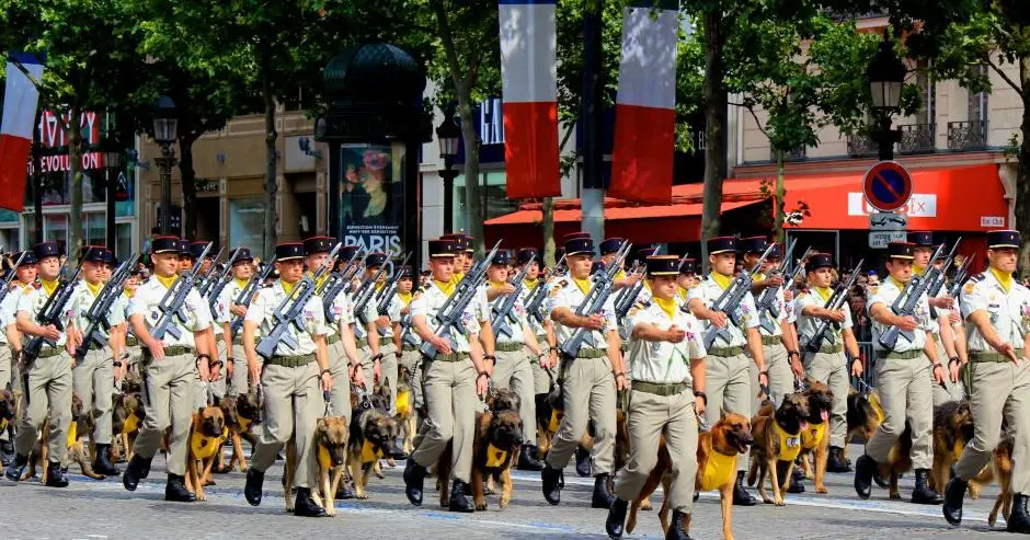 French troops parading down the Champs-Elysées avenue