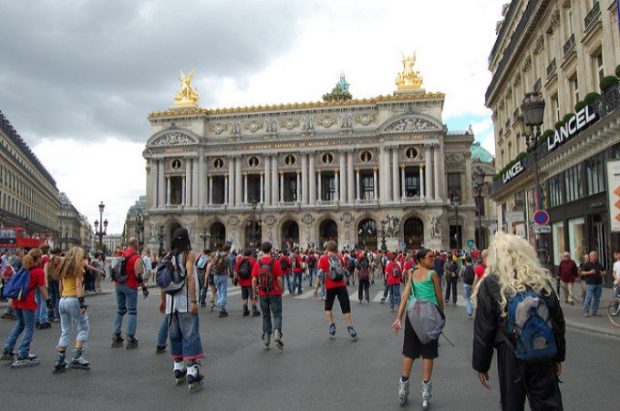 People with rollerblades in front of the Opera Garnier in Paris