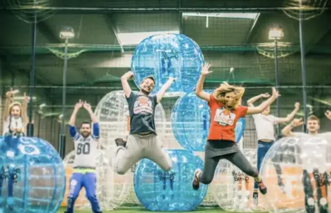 People jumping at a bubble foot