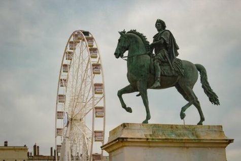 Statue and ferris wheel