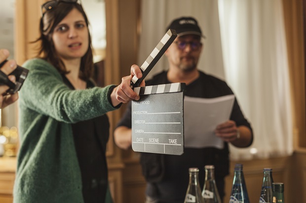 woman holding a clapperboard
