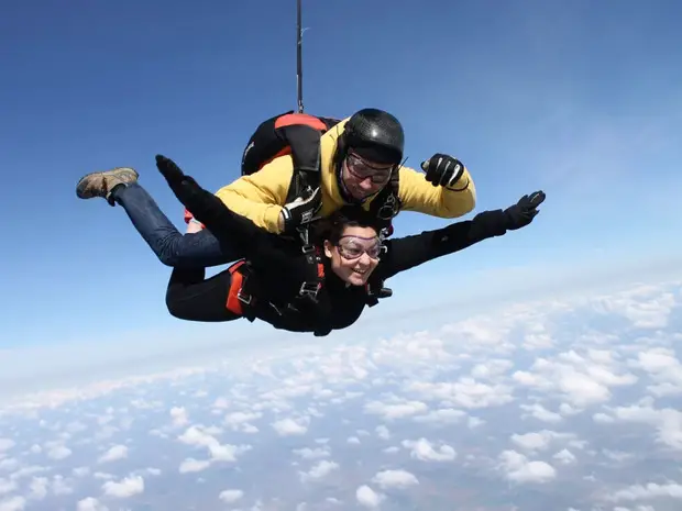 two persons skydiving