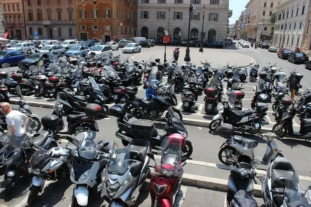 Several parked scooters