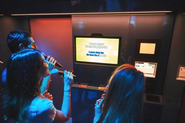 some people singing karaoke